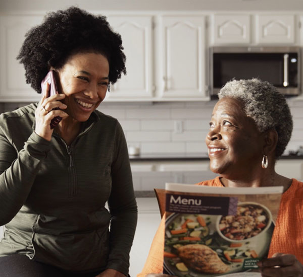 Mother and Daughter looking over menus